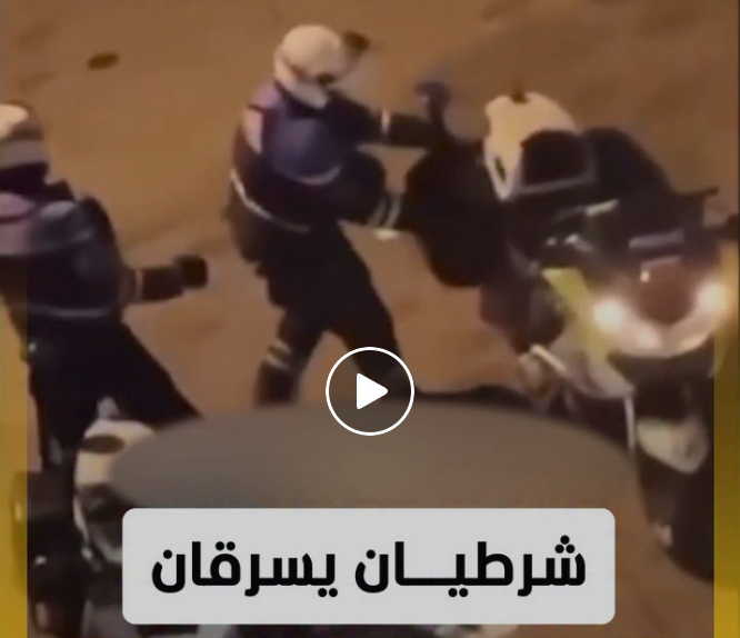 فرنسا .. فيديو شرطيان  يسرقان الملابس وسط فوضى الاحتجاجات !!!